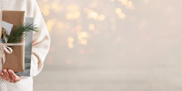 Holiday person holding gift